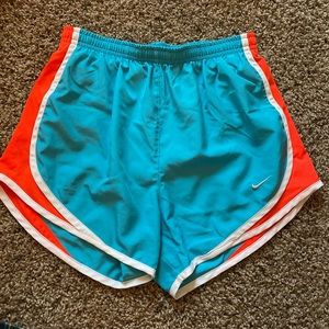 Blue and orange Nike running shorts